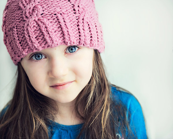 Adorable smiling child in pink hat
